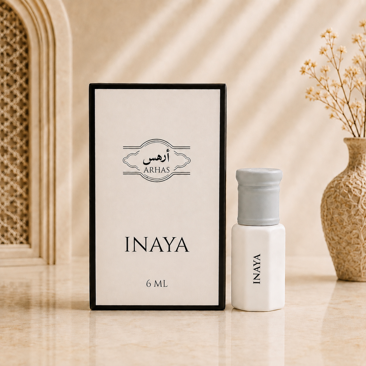 ARHAS Inaya attar oil 6ml roll-on bottle beside its retail box